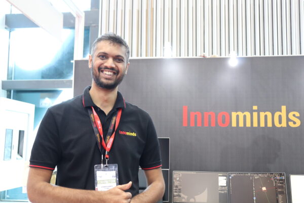 indian IT engineer smiling and laughing and being happy at an IoT Event